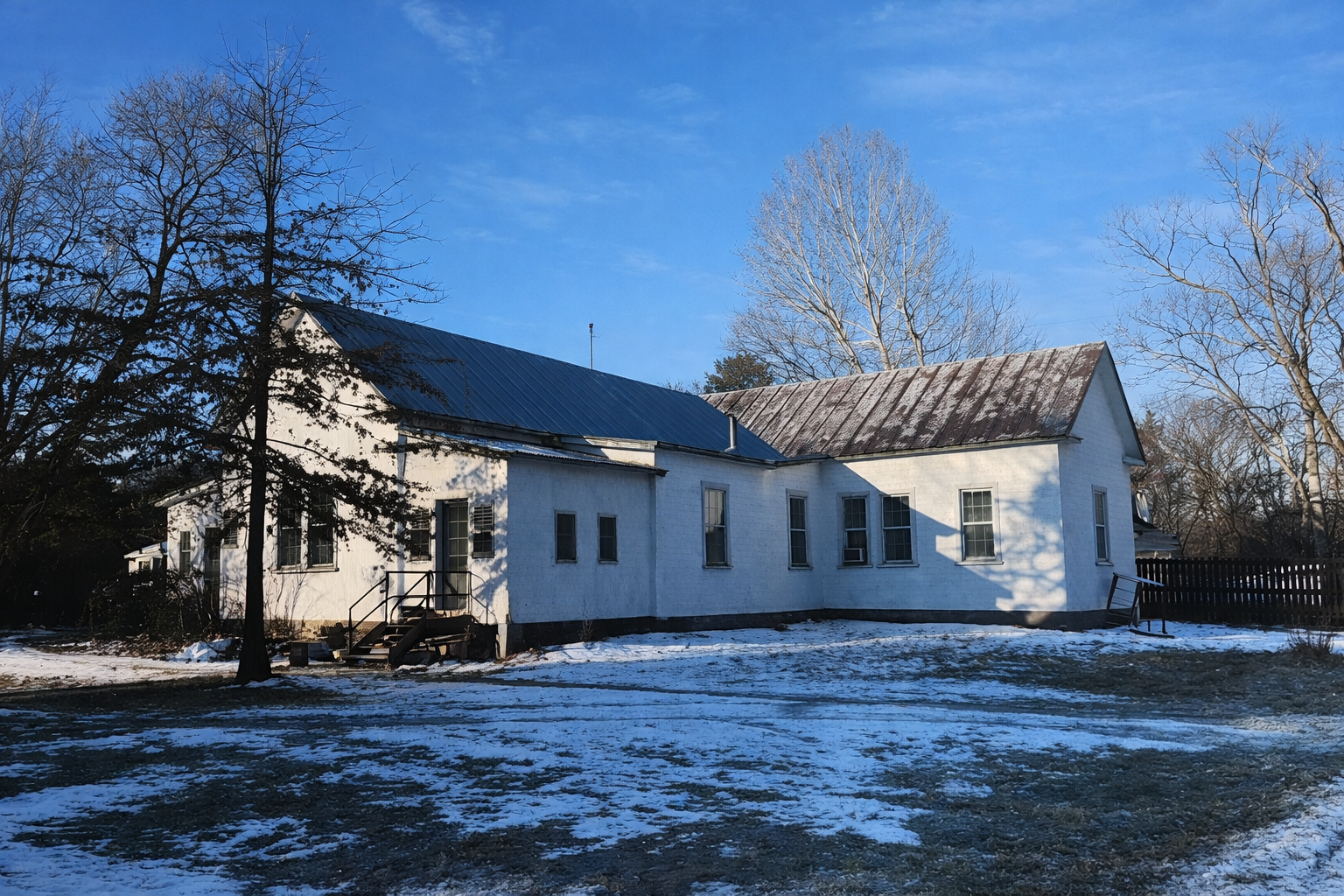 Schoolhouse in snow before renovation